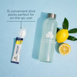 Ancient Nutrition water bottle with lemon flavor stick pack on a blue background