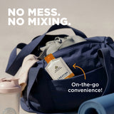 Navy duffel bag with a supplement bottle labeled 'Creatine' and text 'No mess. No mixing.' on a neutral background.
