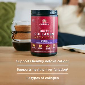 a bottle of multi collagen advanced lean next to a coffee cup