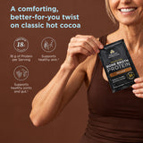 A comforting better-for-you twist on classic hot cocoa. Woman holding a single Bone Broth Protein Hot Cocoa Sachet