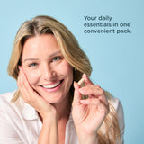 a woman holding a capsule