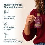 A person in a burgundy knit sweater holds a pouch of Nature's Path Multi Collagen dietary supplement. The left side features marketing text and icons highlighting benefits for skin, hair, nails, antioxidants, and joint comfort.