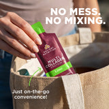 Hand holding a Ancient Nutrition multi collagen protein packet with text 'No mess. No mixing.
