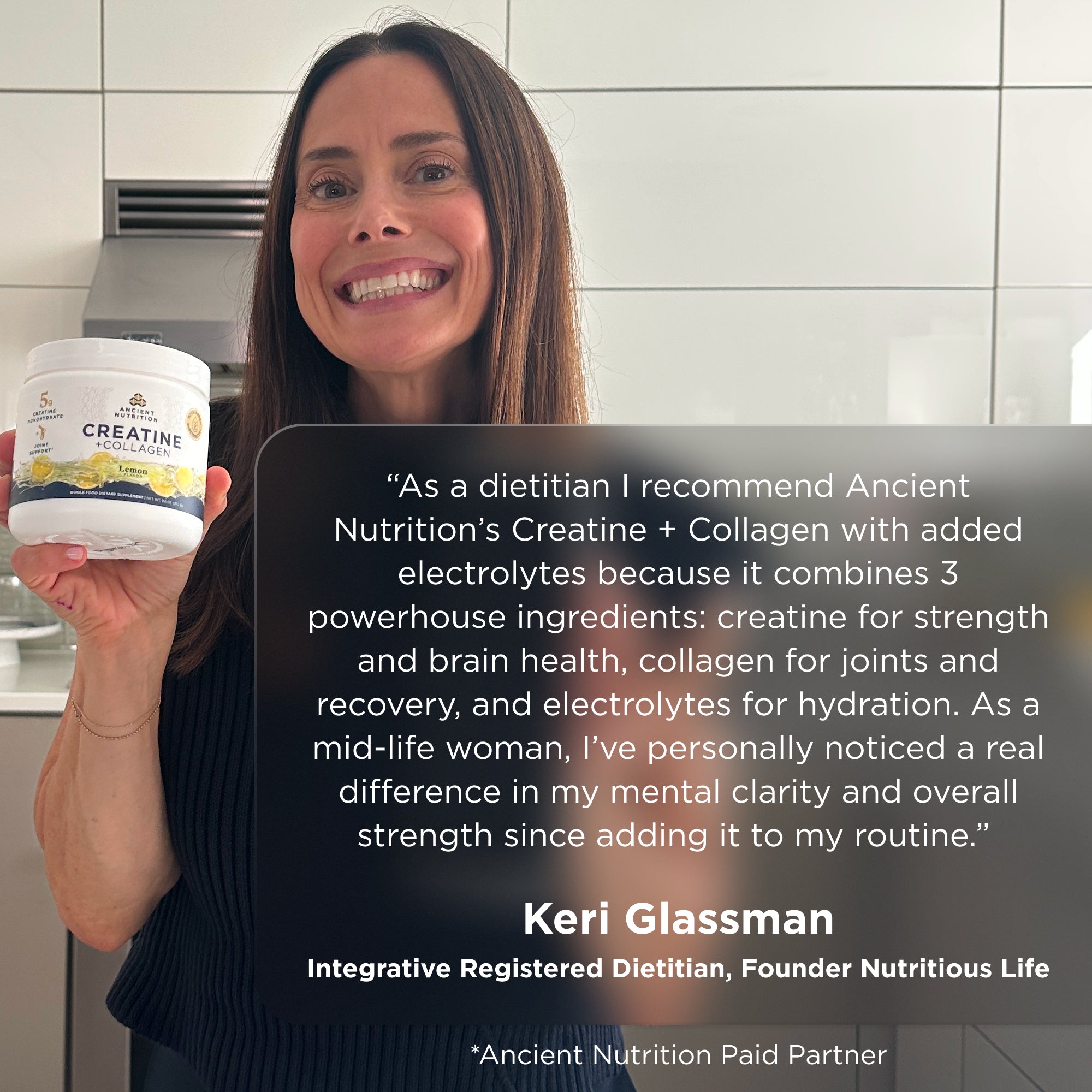 Keri Glassman holding a bottle of creatine + collagen in a kitchen