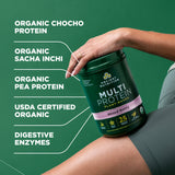 Person holding a protein supplement container with product details on a green background