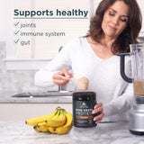 Woman preparing a protein shake with bone broth protein, surrounded by bananas and a blender.