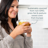 Woman holding a glass of orange juice with text about sustainable sourcing.