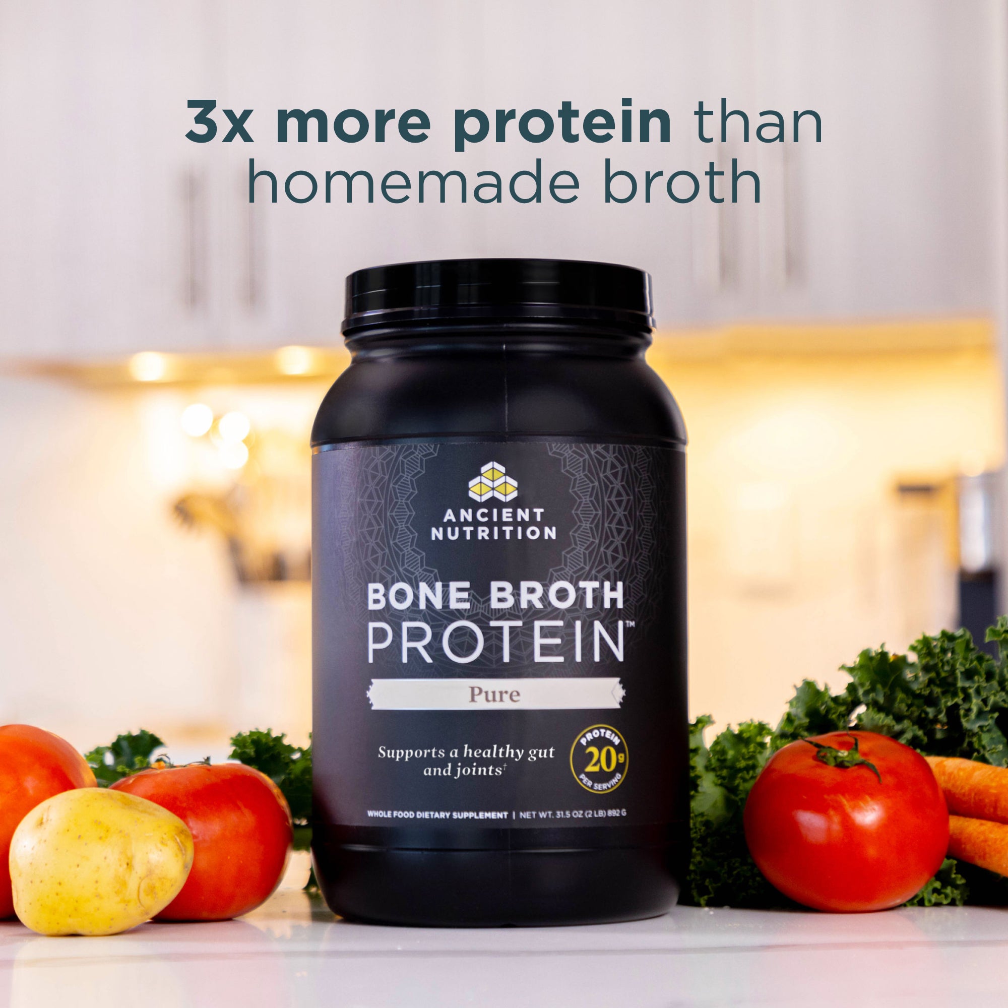 Black container of Ancient Nutrition Bone Broth Protein with vegetables on a kitchen counter