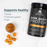 Ancient Nutrition Bone Broth Protein container with salted caramel flavor on a white background