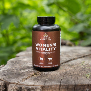 organ blend womens vitality on a tree log