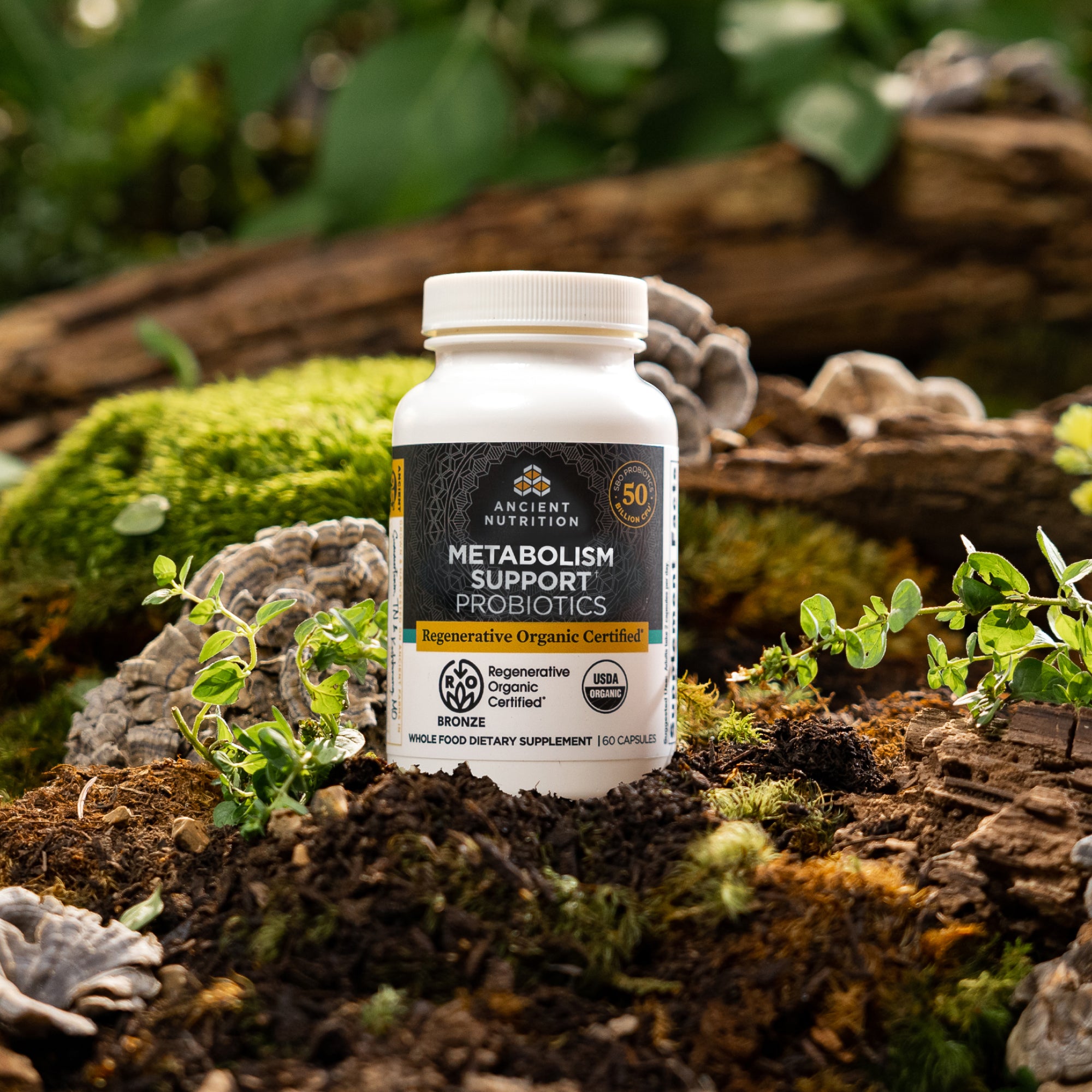 bottle of Regenerative Organic Certified™ Metabolism Support Probiotics on a mossy rock 