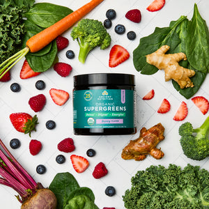 Organic SuperGreens Powder Berry Flavor (12 Servings) surrounded by fruit