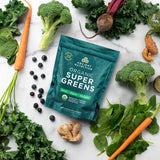 Organic SuperGreens Powder Greens Flavor (50 Servings) surrounded by veggies 