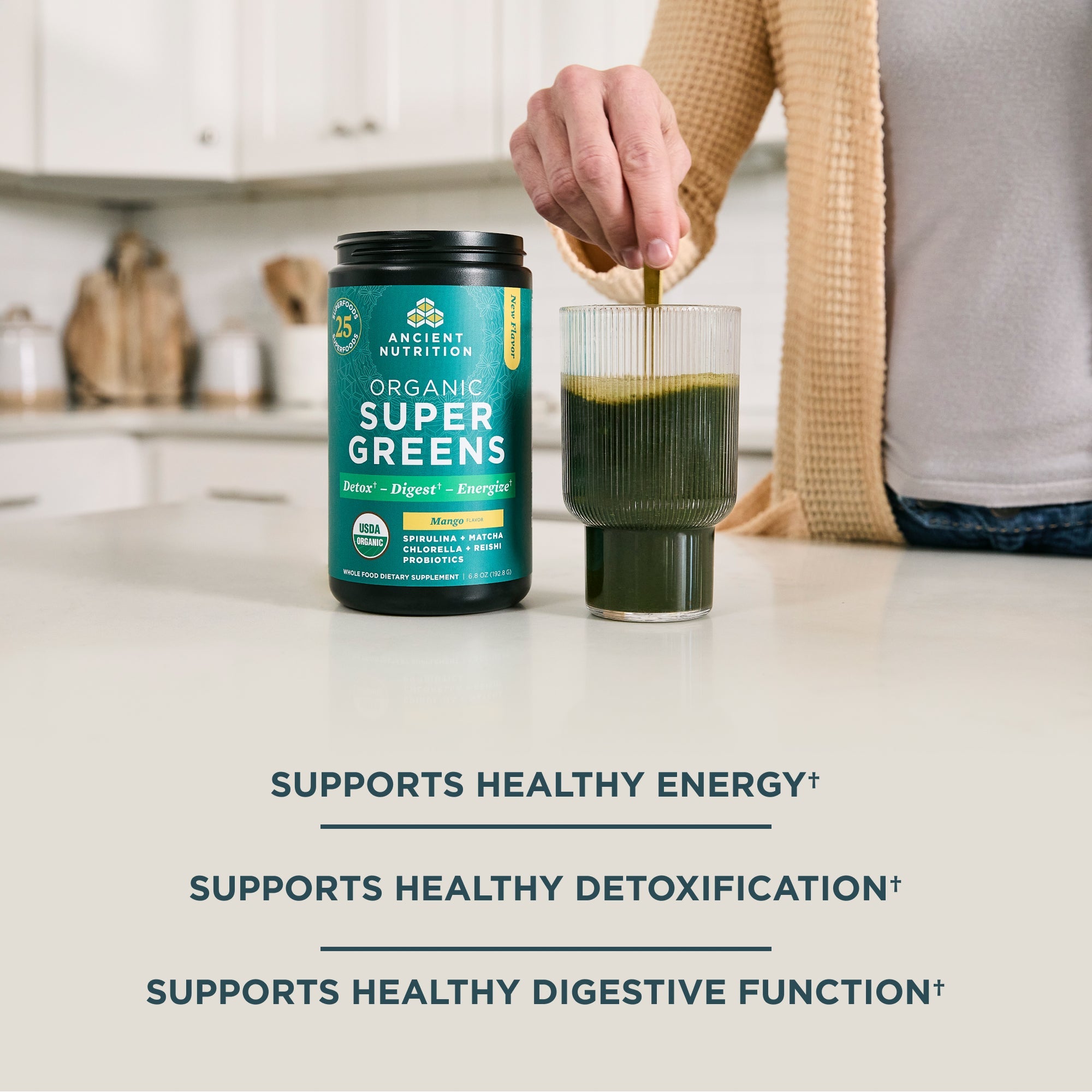 Organic SuperGreens Powder Mango Flavor (25 Servings) on aa kitchen counter