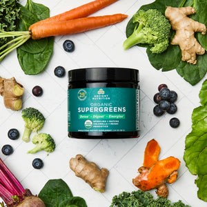 Organic SuperGreens Powder Greens Flavor (12 Servings) surrounded by fruits