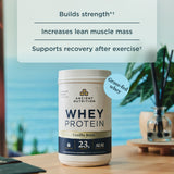 Ancient Nutrition whey protein container with text about benefits on a blurred background