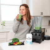 a women drinking a green smoothie made with Collagen Peptides Protein Powder Unflavored 28 Servings