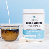 a bottle of Collagen Peptides Protein Powder Unflavored 28 Servings next to a cup of coffee