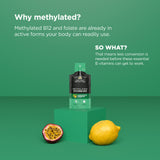 A single supplement packet stands on a green pedestal against a solid green background, with marketing text above and a halved passion fruit and a lemon below as flavor cues. The packet appears black and green with visible branding for 'Methylated Vitamin B12'.