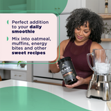 woman holding a bottle of Plant Protein Chocolate next to a blender