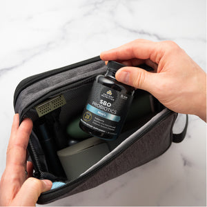 a man taking  SBO Probiotics Men's capsules out of a travel bag