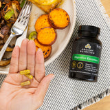 digestive enzymes next to bowl of veggies