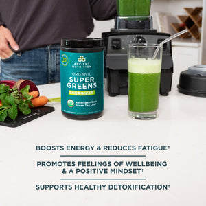 Organic Super Greens Energize Powder next to a blender